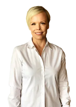 A woman with short blonde hair in a white shirt, representing Kris Karmy, Physical Therapist Assistant at Arlington PT.